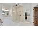 Spa-like bathroom with a glass shower, vanity, and a view into the walk-in closet at 504 Telfair Park, Peachtree City, GA 30269