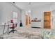 Bright bedroom features a white dresser, soft rug, and stylish wooden door at 504 Telfair Park, Peachtree City, GA 30269