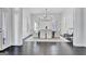Bright and airy dining room featuring a stylish chandelier, ample natural light and elegant decor at 504 Telfair Park, Peachtree City, GA 30269