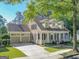 Charming two-story home featuring a welcoming front porch, manicured lawn and a spacious three-car garage at 504 Telfair Park, Peachtree City, GA 30269