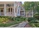 Charming home exterior featuring a landscaped yard and view of the lake at 504 Telfair Park, Peachtree City, GA 30269