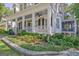 Charming two-story home featuring a beautifully landscaped front yard, porch and decorative columns at 504 Telfair Park, Peachtree City, GA 30269