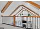 Upper hallway with open view of living space below and natural beam architecture at 504 Telfair Park, Peachtree City, GA 30269