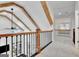 Bright hallway overlooking the living room with beautiful beam ceilings at 504 Telfair Park, Peachtree City, GA 30269