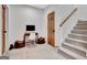 Inviting hallway with wood accents, a study desk and a staircase at 504 Telfair Park, Peachtree City, GA 30269