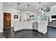 Contemporary kitchen featuring white cabinetry, hardwood floors, and modern fixtures at 504 Telfair Park, Peachtree City, GA 30269