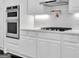 Well-equipped kitchen featuring built-in stainless steel appliances and ample counter space at 504 Telfair Park, Peachtree City, GA 30269