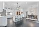 Stylish kitchen with a large island, pendant lighting, and an adjacent dining area at 504 Telfair Park, Peachtree City, GA 30269