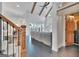 Bright living room featuring a vaulted ceiling, exposed beams, view to the lake and connecting dining room at 504 Telfair Park, Peachtree City, GA 30269