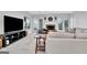 Living room features a stone fireplace and bright windows at 504 Telfair Park, Peachtree City, GA 30269