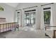 Bright main bedroom showcasing lake views, patio access, and neutral carpeting at 504 Telfair Park, Peachtree City, GA 30269