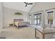 Light-filled main bedroom with vaulted ceilings, lake views, and private access to the deck at 504 Telfair Park, Peachtree City, GA 30269