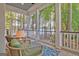 Inviting screened porch with comfortable seating and scenic lake views at 504 Telfair Park, Peachtree City, GA 30269