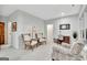 Open sitting area with bright neutral walls featuring plush armchairs and view into adjacent office at 504 Telfair Park, Peachtree City, GA 30269