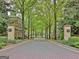 Charming North Cove street view showcasing brick-paved road lined with mature trees at 504 Telfair Park, Peachtree City, GA 30269