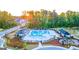 Community pool with cabanas, playground, lush landscaping, and gathering spaces at 566 Silver Moon Drive # 21, Loganville, GA 30052