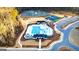 Aerial view of community pool, tennis courts, lake, and playground in a landscaped area at 566 Silver Moon Drive # 21, Loganville, GA 30052
