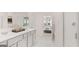 Elegant bathroom with double vanity, marble flooring, and modern fixtures at 566 Silver Moon Drive # 21, Loganville, GA 30052