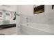 Modern bathroom featuring a soaking tub with marble surround and stylish fixtures at 566 Silver Moon Drive # 21, Loganville, GA 30052