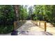 Wooden bridge along a nature trail offering residents access to walking and enjoying the beautiful natural surroundings at 566 Silver Moon Drive # 21, Loganville, GA 30052
