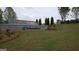 Community entrance with stone waterfall feature and beautifully landscaped grounds at 566 Silver Moon Drive # 21, Loganville, GA 30052