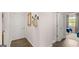Hallway with access to a bedroom and decorated with a mirror, hooks and a bag at 566 Silver Moon Drive # 21, Loganville, GA 30052
