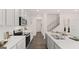 Modern kitchen with white cabinets, stainless steel appliances, and a center island with seating at 566 Silver Moon Drive # 21, Loganville, GA 30052