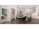 Well-designed kitchen featuring a large pantry, center island with bar stools, and open view to the living room at 566 Silver Moon Drive # 21, Loganville, GA 30052