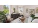 Inviting living room with large windows, stylish furnishings, and ample natural light at 566 Silver Moon Drive # 21, Loganville, GA 30052