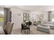 Open-concept living area with comfortable seating, modern decor, and ample natural light at 566 Silver Moon Drive # 21, Loganville, GA 30052