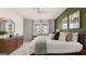 Comfortable primary bedroom featuring ample natural light, a large bed, and neutral decor for a peaceful retreat at 566 Silver Moon Drive # 21, Loganville, GA 30052