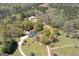 Aerial view of estate featuring landscaped grounds, pool, residence, and outbuildings at 935 Amelia Rd, Locust Grove, GA 30248