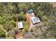 Aerial view of property featuring multiple outbuildings and surrounding greenery at 935 Amelia Rd, Locust Grove, GA 30248