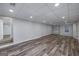 Finished basement featuring laminate flooring, recessed lighting, and a window for natural light at 935 Amelia Rd, Locust Grove, GA 30248
