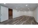 Finished basement with laminate flooring and access to a secondary room at 935 Amelia Rd, Locust Grove, GA 30248