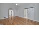 Spacious bedroom with hardwood floors, white trim, and access to an ensuite bathroom at 935 Amelia Rd, Locust Grove, GA 30248