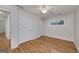 Bright bedroom featuring wood floors, a ceiling fan and a window with natural light at 935 Amelia Rd, Locust Grove, GA 30248