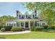 Stately two-story home with dormer windows, brick chimneys, and a manicured lawn at 935 Amelia Rd, Locust Grove, GA 30248