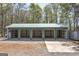 A metal, 3-bay garage featuring open storage bays and concrete apron at 935 Amelia Rd, Locust Grove, GA 30248
