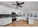 Modern kitchen equipped with stainless appliances, granite countertops, and hardwood floors at 935 Amelia Rd, Locust Grove, GA 30248