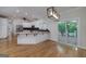 Beautiful kitchen with granite counters, an island, stainless appliances, and a sliding door to the deck at 935 Amelia Rd, Locust Grove, GA 30248