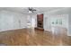Inviting living room boasts a brick fireplace and hardwood floors at 935 Amelia Rd, Locust Grove, GA 30248