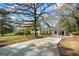 Charming exterior showcasing a well-manicured lawn, covered parking, and tasteful landscaping, enhancing its appeal at 1146 Redan Way, Stone Mountain, GA 30088