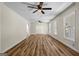 Spacious living room featuring modern ceiling fans, hardwood floors, and an arched doorway at 1146 Redan Way, Stone Mountain, GA 30088
