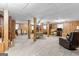 Spacious basement featuring wood paneled walls, carpet floors and a drop ceiling at 1407 Highway 92 N, Fayetteville, GA 30214