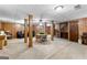 Expansive carpeted basement with wood support columns, recreational area and access to stairs at 1407 Highway 92 N, Fayetteville, GA 30214