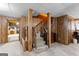 Basement with finished wood paneling and a staircase leading to an upper level at 1407 Highway 92 N, Fayetteville, GA 30214