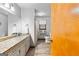 Bright bathroom featuring double sink vanity with granite countertop and new fixtures at 1407 Highway 92 N, Fayetteville, GA 30214