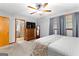 Bedroom with neutral carpet, soft lighting, and ensuite bathroom access at 1407 Highway 92 N, Fayetteville, GA 30214