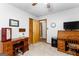 Spacious bedroom featuring a desk, a window, and neutral-toned walls at 1407 Highway 92 N, Fayetteville, GA 30214